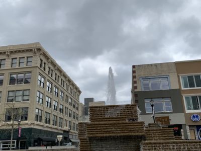 The fountain in Park Central Square with a cloudy sky behind it