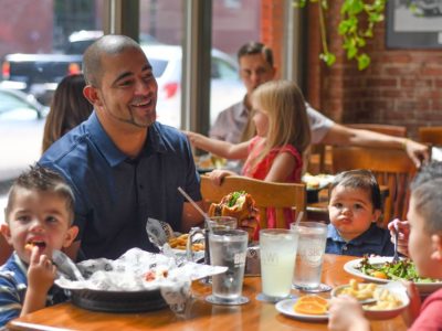 A father eats lunch with his children at Springfield Brewing Company